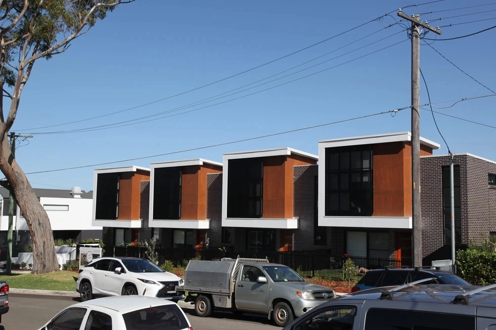 Modern townhouse units with timber and brick exterior