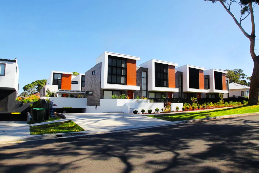 Modern townhouse row with brick and wood accents