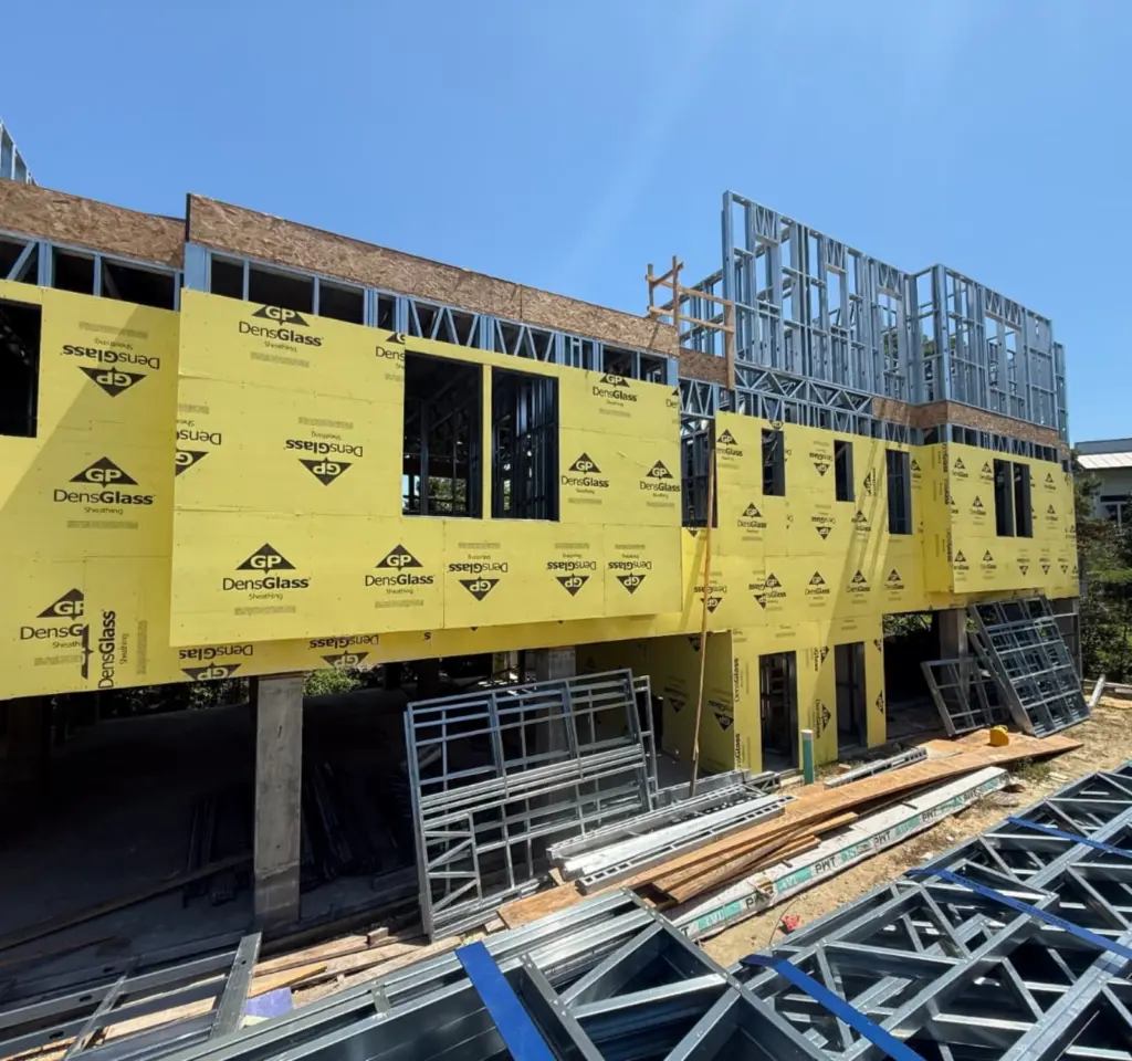 Light gauge steel structure with exterior sheathing during building construction.